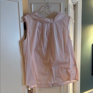 Channel your inner Jackie O, with this elegant Pink Sleeveless Top